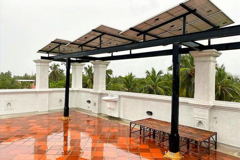 Solar canopy structure over an open parking area