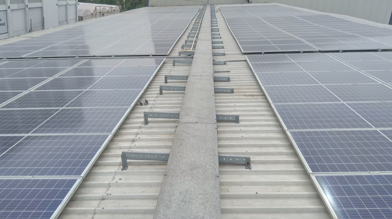 Central ridge walkway between module rows on the spices plant GI-sheet roof
