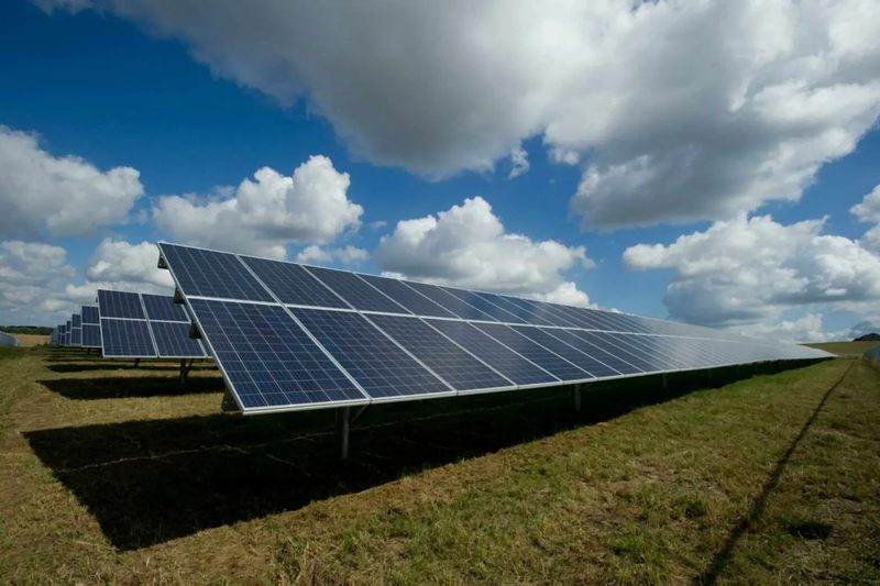 Fixed-tilt ground-mount solar rows on open land